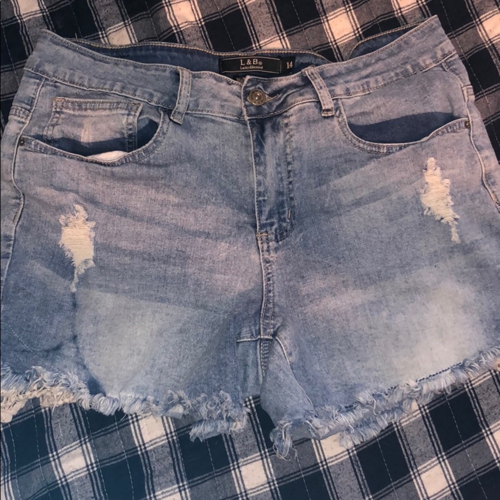 Denim mid thigh jean shorts.